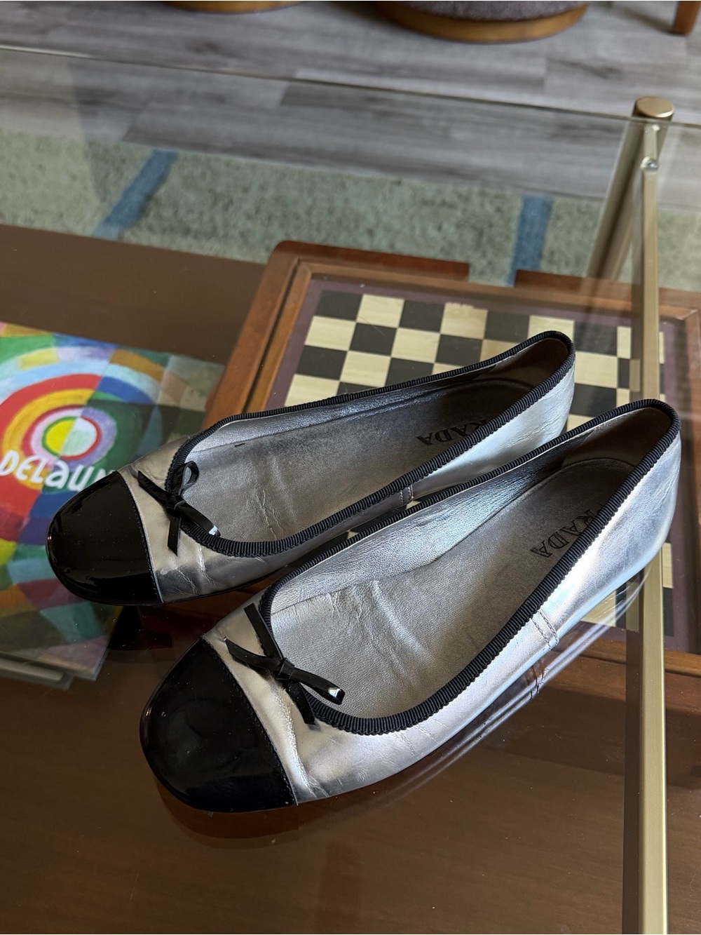 PRADA • metallic silver bow cap toe ballet flats